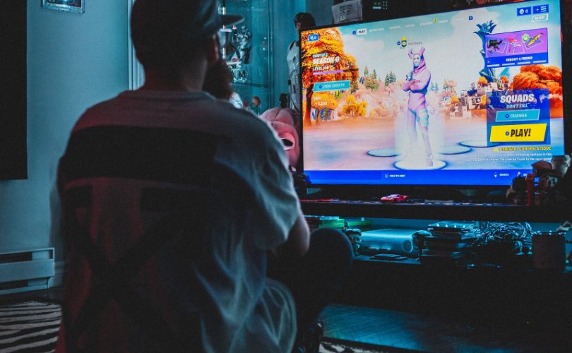 Man playing video games alone